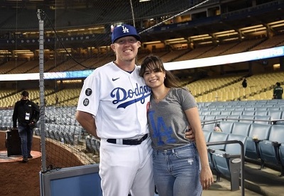 Garrett Cleavinger poses with wife Helen on the field of Dodgers stadium